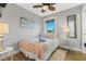 Comfortable bedroom features a ceiling fan and a window with plenty of natural light at 5402 31St S Ave, Gulfport, FL 33707