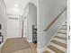 Welcoming entryway features wood floors, stairs, and neutral paint at 5402 31St S Ave, Gulfport, FL 33707