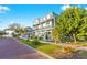 Charming exterior view of a three-story coastal home with inviting balconies and lush landscaping at 5402 31St S Ave, Gulfport, FL 33707