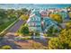 Charming exterior view of a three-story coastal home with inviting balconies and lush landscaping at 5402 31St S Ave, Gulfport, FL 33707