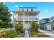 Charming two-story home with a welcoming entrance and beautifully landscaped yard at 5402 31St S Ave, Gulfport, FL 33707