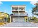 Beautiful three-story home featuring a two-car garage and outdoor entertainment space at 5402 31St S Ave, Gulfport, FL 33707