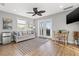Cozy living area with a mini-fridge, sofa, small table and an outdoor balcony at 5402 31St S Ave, Gulfport, FL 33707
