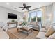 Cozy living room with stylish furniture, a large window, and modern fan at 5402 31St S Ave, Gulfport, FL 33707