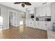 Living space featuring modern cabinetry, mini-fridge, sink, sofa, and open doorway to bedroom at 5402 31St S Ave, Gulfport, FL 33707