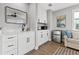 Inviting living room with modern cabinetry, mini-fridge, sink, and comfortable seating area at 5402 31St S Ave, Gulfport, FL 33707