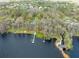 An aerial view shows the property, waterfront, dock and surrounding community at 6302 Fitzgerald Rd, Odessa, FL 33556