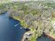 An aerial view shows the property, waterfront, dock and surrounding community at 6302 Fitzgerald Rd, Odessa, FL 33556