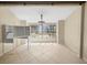 Dining room with lake view, tile floors and a decorative chandelier at 6302 Fitzgerald Rd, Odessa, FL 33556