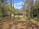 Charming home nestled on a wooded lot with mature trees offering natural shade at 6302 Fitzgerald Rd, Odessa, FL 33556