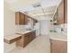 Kitchen with tile floors, bright countertops and white appliances at 6302 Fitzgerald Rd, Odessa, FL 33556