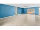 Large living room with tile floors and sliding glass doors providing access to the outdoor area at 6302 Fitzgerald Rd, Odessa, FL 33556