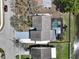 Overhead aerial view of house showcasing roof, screened pool, landscaping, and driveway at 641 Bay Lake Trl, Oldsmar, FL 34677