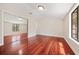 Bedroom with hardwood floors, window and closet with mirror sliding doors at 641 Bay Lake Trl, Oldsmar, FL 34677