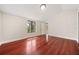 Cozy bedroom with hardwood floors, a window with water view, and neutral paint, creating a warm atmosphere at 641 Bay Lake Trl, Oldsmar, FL 34677