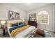 Stylish bedroom features a unique arched window, contemporary decor, and a calming color palette at 641 Bay Lake Trl, Oldsmar, FL 34677