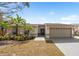 Charming single-story home with a two-car garage, well-maintained lawn, and lush landscaping at 641 Bay Lake Trl, Oldsmar, FL 34677