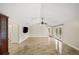 Bright living room featuring vaulted ceilings, tile floors, and french doors to the outdoor area at 641 Bay Lake Trl, Oldsmar, FL 34677