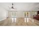 Bright living room featuring vaulted ceilings, tile floors, and french doors to the outdoor area at 641 Bay Lake Trl, Oldsmar, FL 34677