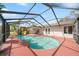 View of the pool area, featuring a pool slide, patio seating, and an enclosed screen at 641 Bay Lake Trl, Oldsmar, FL 34677