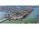 Aerial view of waterfront homes with docks on a sunny day near a bridge at 7998 Causeway N Blvd, St Petersburg, FL 33707