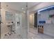 Tastefully renovated bathroom, shower, walk-in closet, toilet and vessel sink at 7998 Causeway N Blvd, St Petersburg, FL 33707