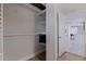 Walk-in closet featuring functional shelving, providing ample storage in modern home at 7998 Causeway N Blvd, St Petersburg, FL 33707