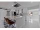 Modern white kitchen boasts an island, stainless steel appliances, and sleek cabinetry at 7998 Causeway N Blvd, St Petersburg, FL 33707