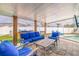 Relaxing outdoor patio features cushioned seating, a rustic coffee table, and an inviting atmosphere at 7998 Causeway N Blvd, St Petersburg, FL 33707