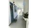 Exterior building hallway featuring light paint, a door with a wreath, and a pineapple welcome mat at 8080 112Th St # 206, Seminole, FL 33772