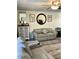 Bright living room with light-colored walls, modern accents, loveseat and reclining loveseat at 8080 112Th St # 206, Seminole, FL 33772