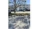 Condo complex parking lot showing car spaces and building entrance at 8080 112Th St # 206, Seminole, FL 33772