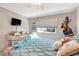 Bright bedroom with a white wicker desk, cozy bedding, and ample natural light at 845 Jolanda Cir, Venice, FL 34285