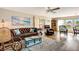 Inviting living room with coastal accents, comfortable seating, and wood-style flooring at 845 Jolanda Cir, Venice, FL 34285
