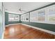Bedroom featuring hardwood flooring and white shuttered windows, offering ample natural light at 864 15Th Ne Ave, St Petersburg, FL 33704