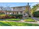 Charming two-story home featuring stone facade, mature landscaping, and a welcoming entrance at 864 15Th Ne Ave, St Petersburg, FL 33704