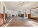 Large living room space features a fireplace, ceiling fan, and hardwood floors at 864 15Th Ne Ave, St Petersburg, FL 33704