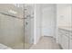 Bright bathroom boasts a glass shower with tiled walls and built-in shelves at 9429 Shorebird Ct, Parrish, FL 34219