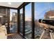 Cozy living room enhanced by a telescope, offering stunning cityscape views through expansive windows at 1 Beach Se Dr # 2414, St Petersburg, FL 33701