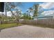 Brick patio area with fence and trees in background at 1316 Barry St, Clearwater, FL 33756