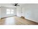 This bedroom has hardwood floors, fresh paint and a ceiling fan at 1316 Barry St, Clearwater, FL 33756
