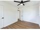 A bright bedroom with hardwood floors, a ceiling fan and fresh paint at 1316 Barry St, Clearwater, FL 33756
