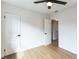 Bedroom with hardwood floors, fresh paint, and a ceiling fan at 1316 Barry St, Clearwater, FL 33756