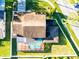 Aerial shot showcasing the property, pool area, backyard, and surrounding neighborhood at 1375 Corner Oaks Dr, Brandon, FL 33510