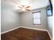 Bedroom features hardwood floors, ceiling fan and natural lighting at 1375 Corner Oaks Dr, Brandon, FL 33510