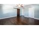 Bedroom with hardwood floors, ceiling fan and access to closet space at 1375 Corner Oaks Dr, Brandon, FL 33510