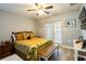 Relaxing bedroom with ceiling fan, ample light, french doors and wood-look flooring at 1375 Corner Oaks Dr, Brandon, FL 33510