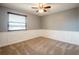 Bedroom features a ceiling fan and decorative trim at 1375 Corner Oaks Dr, Brandon, FL 33510