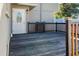 Back deck with wood railings and an exterior door at 1375 Corner Oaks Dr, Brandon, FL 33510