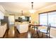 Bright and inviting kitchen featuring granite countertops, stainless steel appliances, and a cozy breakfast nook at 1375 Corner Oaks Dr, Brandon, FL 33510